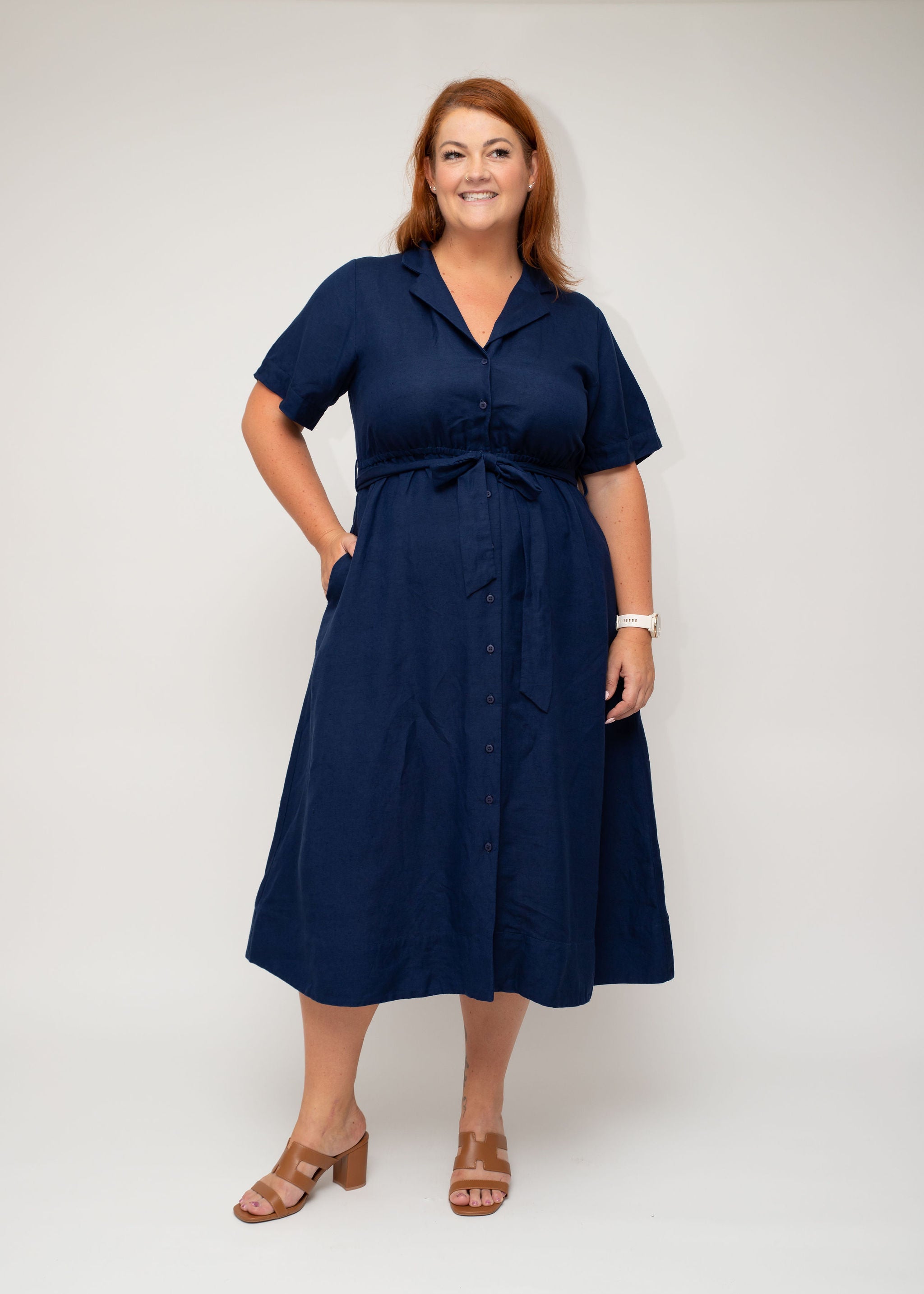 Navy linen shirt dress with button-down detail and a belted waist, offering a flattering silhouette. Perfectly designed for curvy women by I Feel Pretty, featuring functional pockets.