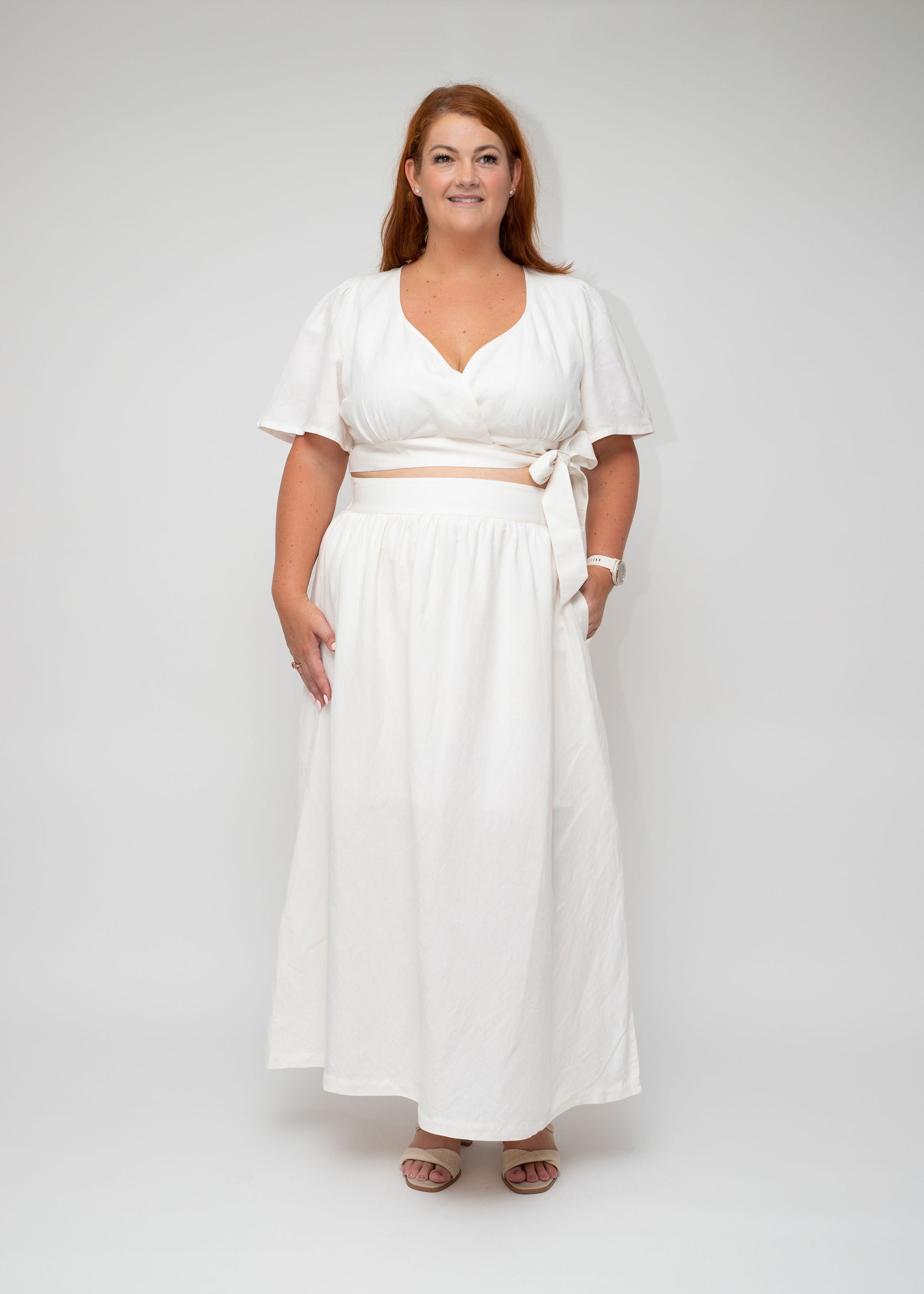 White Linen Wrap Top and Maxi Skirt front angle showcasing the elegant wrap detail and comfortable fit, designed for curvy women seeking stylish summer essentials.