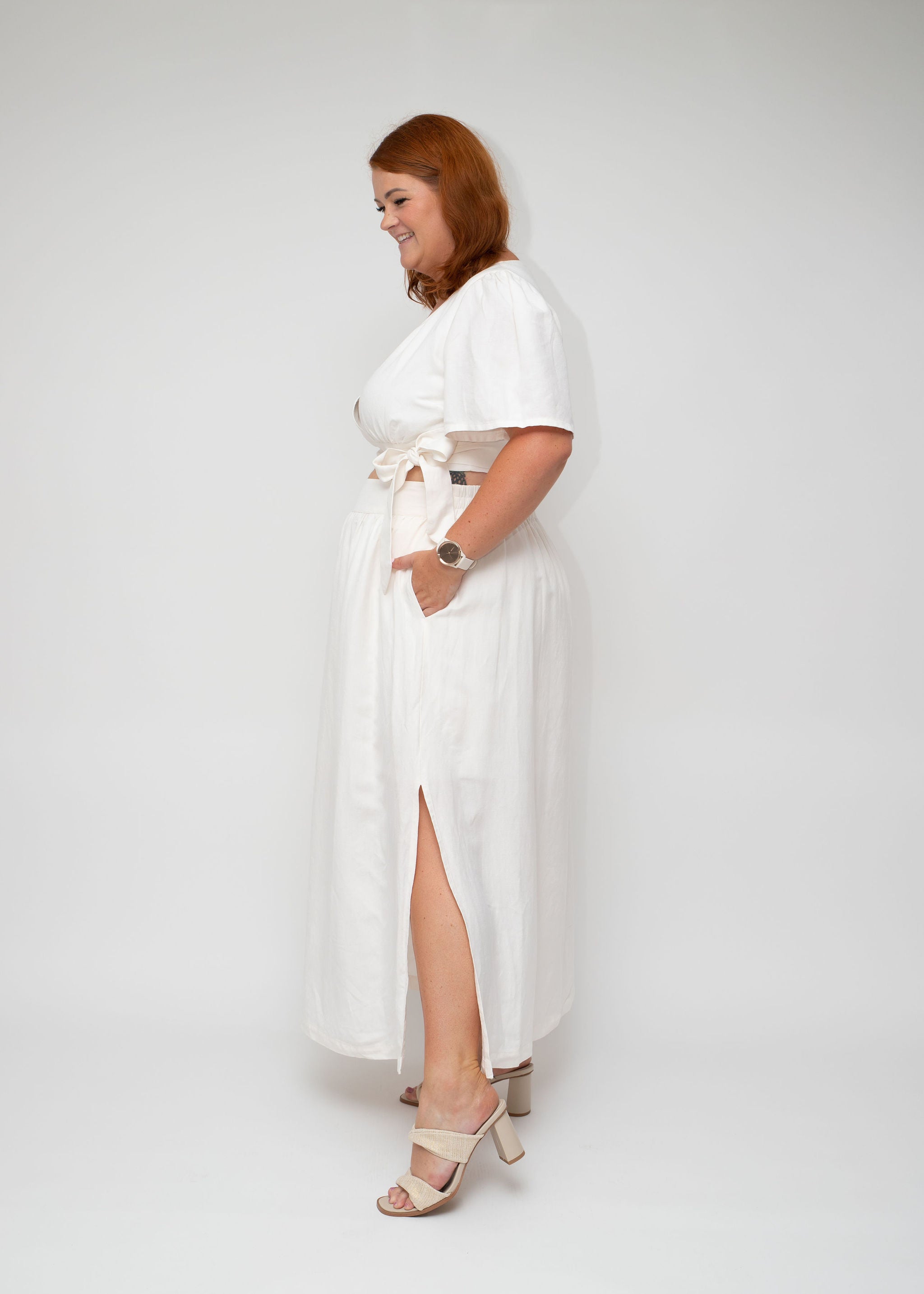 Side view of the White Linen Wrap Top paired with the White Linen Maxi Skirt, highlighting the wrap detail and flowing silhouette, from the I Feel Pretty curvy women’s collection in Australia.