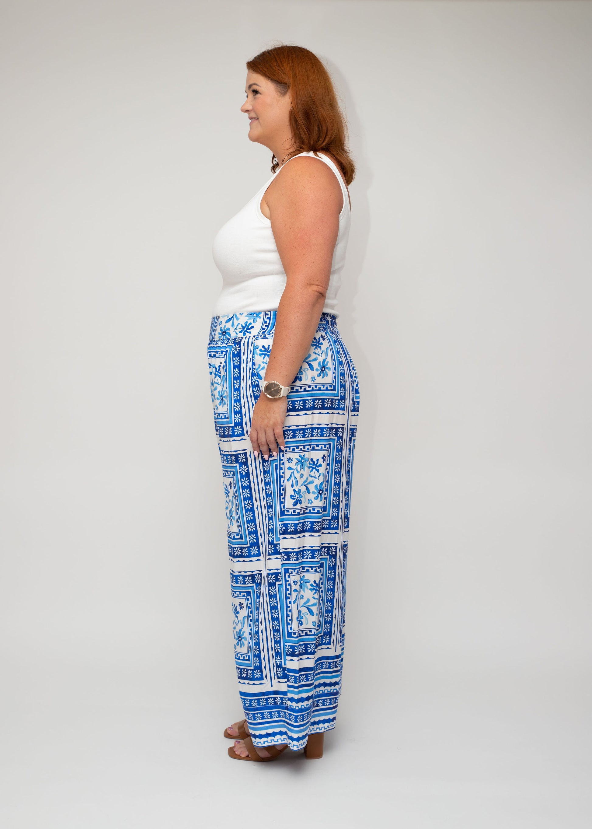 Side profile of the white ribbed top and Shasta Tile palazzo pants, showcasing the flattering cut and easy movement for everyday wear.