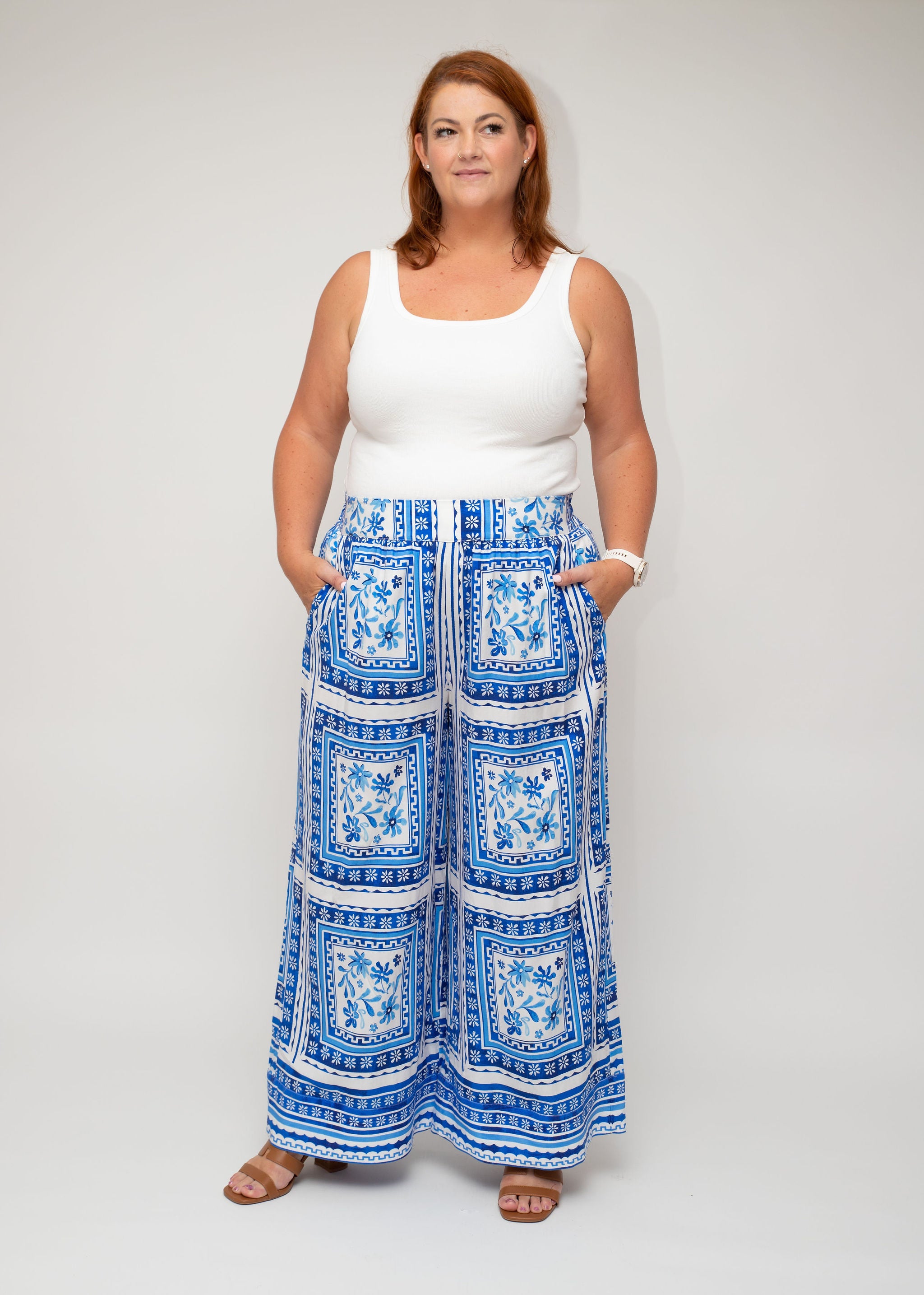 Front view of the white ribbed top styled with Shasta Tile palazzo pants, highlighting the elegant tile-inspired pattern and flowing fit.